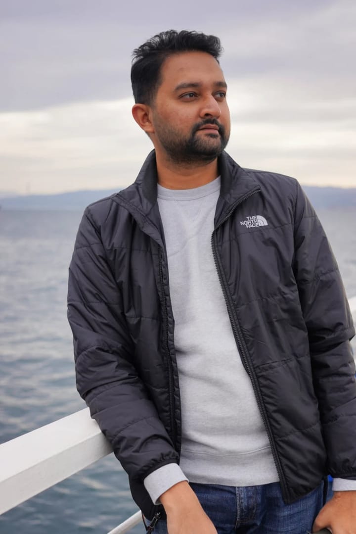Paul Joseph, host of Frame to Funnel, standing at a waterfront railing
